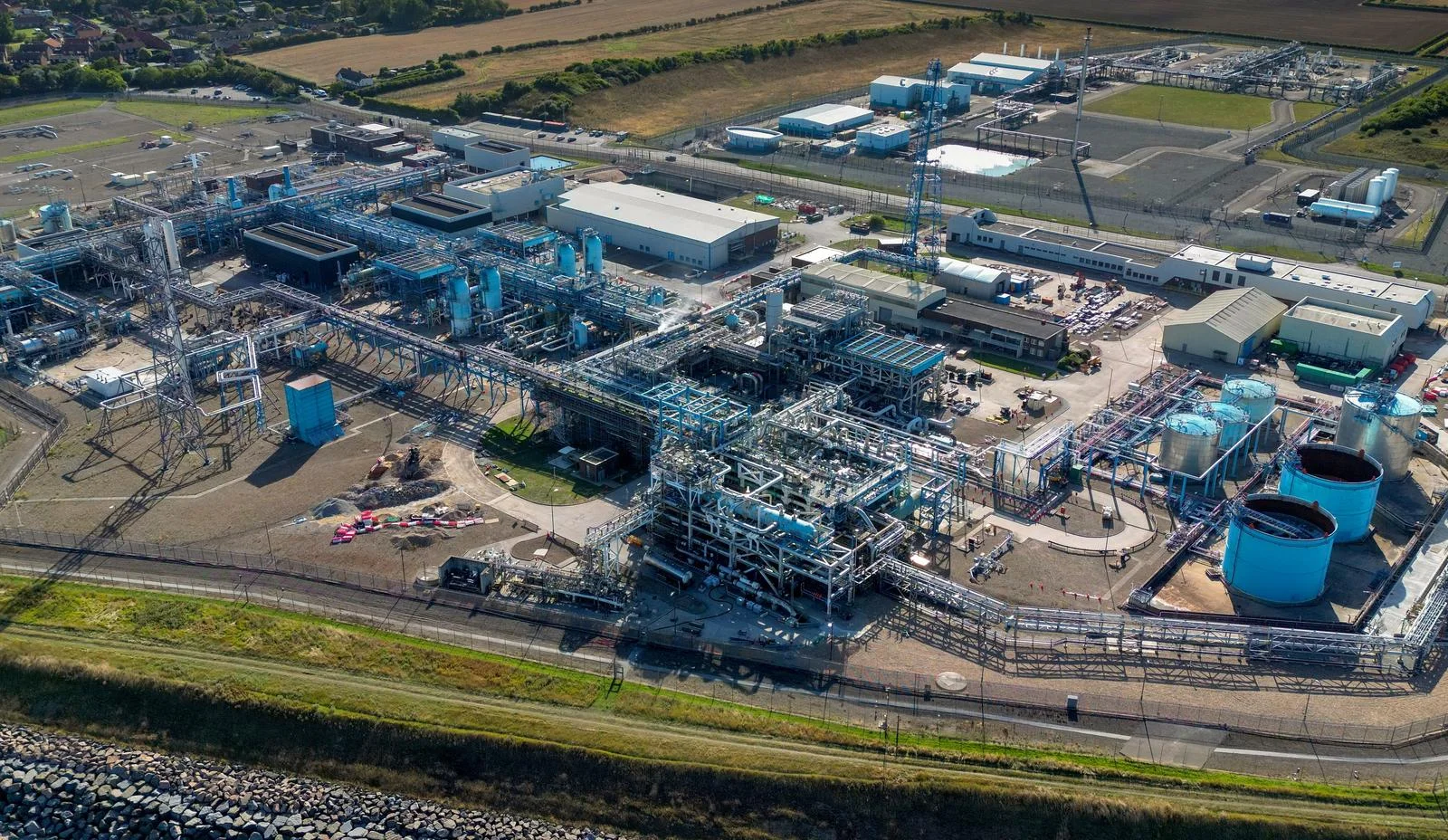 Site context: Aerial photograph of gas-processing equipment, buildings and pipework at the coastal Easington terminal complex.
