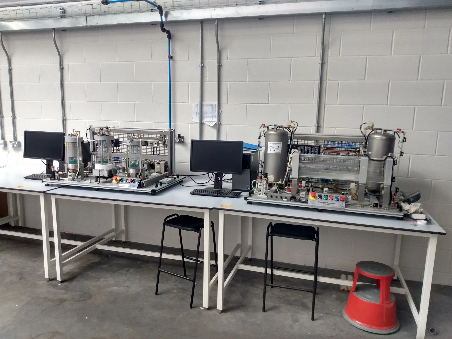 IPC process-control trainer and TPS200 three-phase separator side by side with their connected PCs at Forth Valley College.