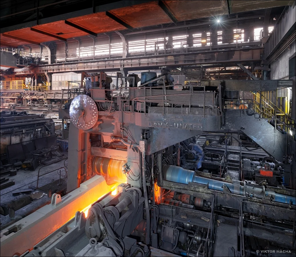 The Stocksbridge 40-inch rolling mill processing a glowing steel workpiece.